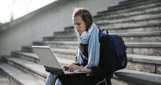 A girl carrying a laptop backpack
