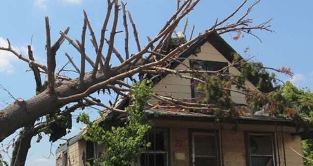 house damaged by windstorm